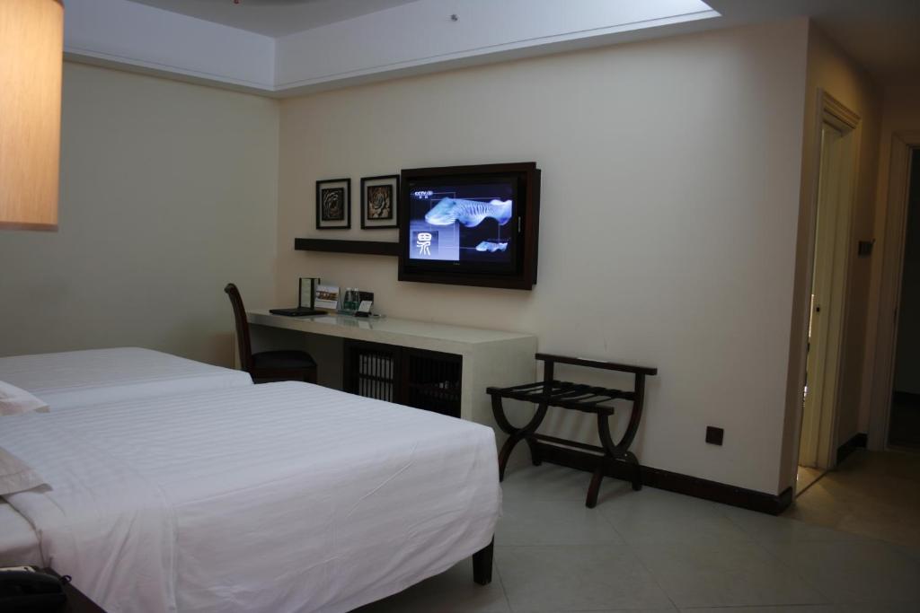 Guesthouse International Hotel Sanya Quarto foto